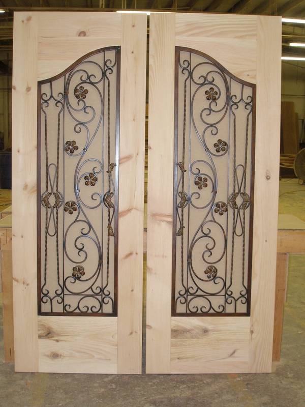 Unfinished wooden door with custom embellishment