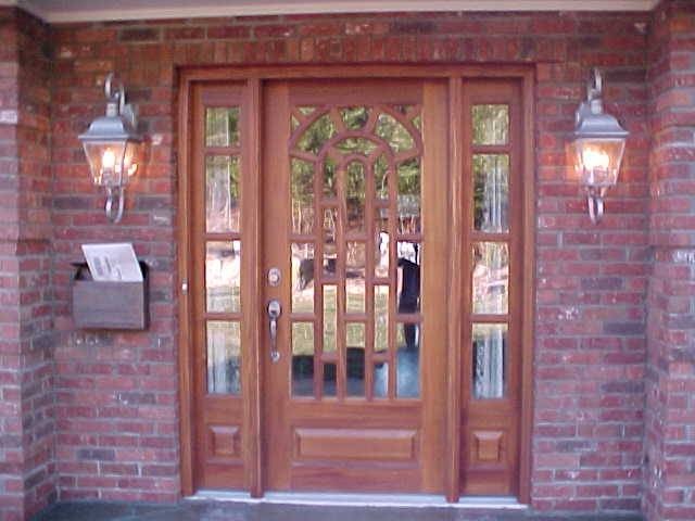 Wooden front door with custom glass panels